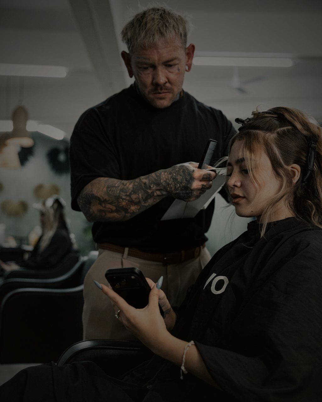 Morgan cutting a client's hair